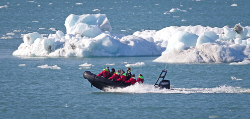 Fototapeta premium JOKULSARLON, ICELAND - July 30, 2021: Boat adventure on Jokulsarlon glacier lake on July 30, 2021.