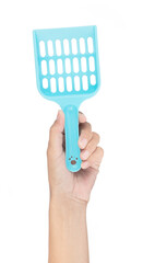 Hand holding Blue Plastic Scoop Pet Sand Isolated on a white background.