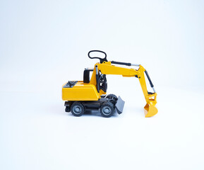 Fototapeta na wymiar Excavator crawler loader model on white background. Back side view. Real Shoot.
