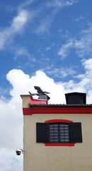 Chimney Sweeper Sculpture on the roof, Klaipeda, Lithuania