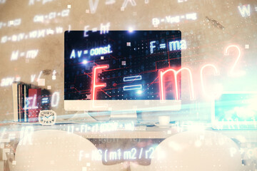 Double exposure of formulas drawing and office interior background. Concept of education.