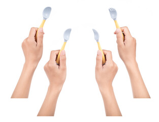 Collection of hand holding Bendable kids training Spoon Fork Set isolated on white background.