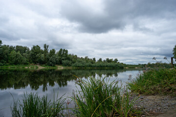 Beautiful view of Ukrainian Desna river, calm waters, dramatic skies