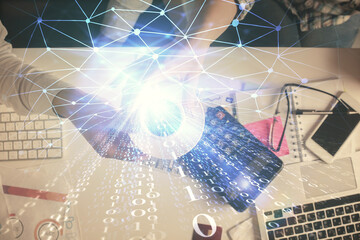 Double exposure of man and woman working together and data theme hologram drawing. Computer background. Top View.