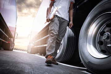 Truck Drivers Walking The Checking Truck Wheels Tires. Inspection Maintenance Safety forTruck Driving. Industry Freight Truck Transport.