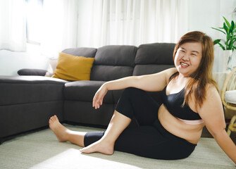 Body confidence. Asian woman Overweight plus size woman wearing sportswear for exercising. self confident Body positive concept.