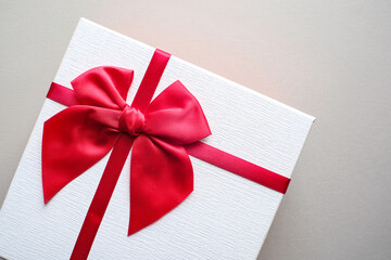 Valentine present. Gift box and red ribbon for romantic couple.Gift box and ribbon with tag for valentine present
