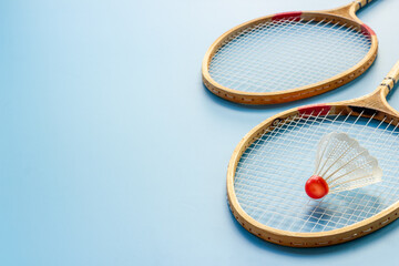 Two badminton rackets and shuttlecock close up