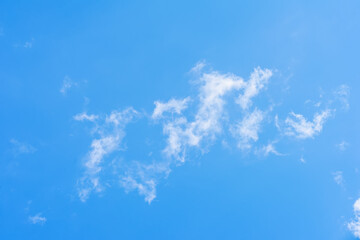 Fototapeta na wymiar Blue sky and light delicate white clouds, clear sunny day, natural background