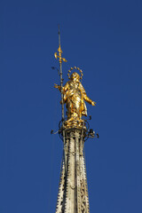 The Madonnina statue of the Virgin Mary atop Milan Cathedral, Italy.