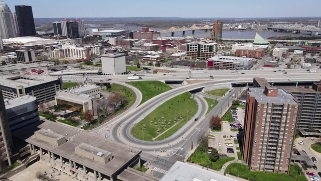 Aerial View, Louisville, Kentucky USA. Downtown Traffic and Buildings With Ohio River Bridges in Background, Drone Shot 60fps