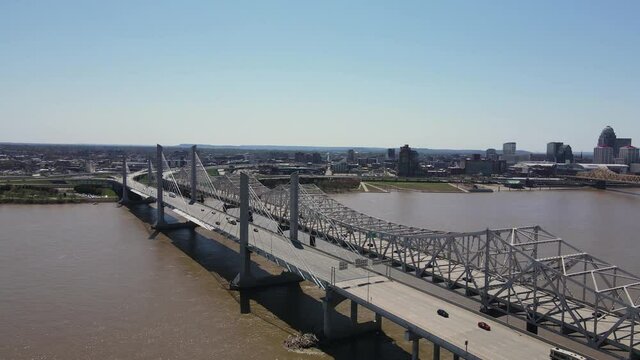 Aerial View, Traffic on Memorial Bridges Above Ohio River, Louisville, Kentucky. Abraham Lincoln and John F. Kennedy Bridge, Drone Shot
