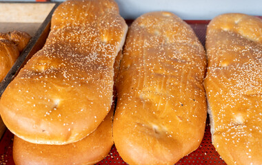 Fresh caucasian bread with sesame seeds sale at the city farmers market