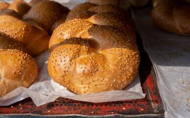 Fresh Challah with sesame seeds sold at the city farmers market