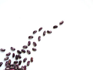 Beans are sprinkled on a white table. Place for your text.