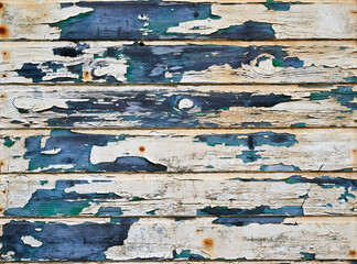 Closeup shot of peeling paint on wooden slats - obrazy, fototapety, plakaty