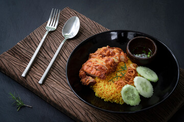 Muslim yellow rice with fried chicken
