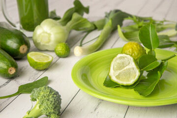 Fototapeta na wymiar Green vegetables on white wooden background, healthy lifestyle, vegetarian eating