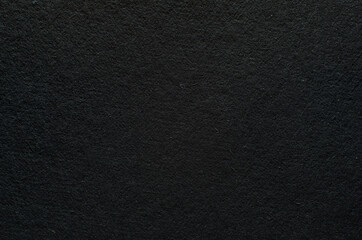 Fototapeta na wymiar Rough texture of black paper with fibers, macro photography. Close-up paper background top view
