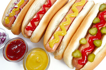 hot dogs with mustard and ketchup isolated on white background