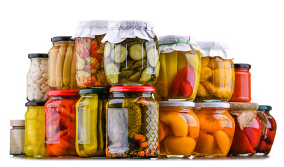 Jars with variety of marinated vegetables and fruits