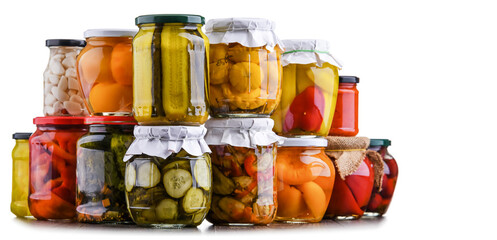 Jars with variety of marinated vegetables and fruits