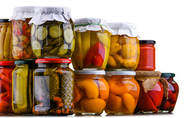 Jars with variety of marinated vegetables and fruits