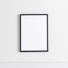 Black photo frame mockup on white wall. Front view