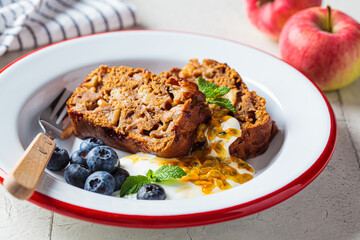 Slices of vegan fruit pie with cream, berries and fruit. Vegan dessert concept.