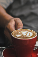 person holding a cup of coffee