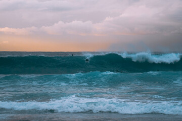 Silhoette of surfer at sunrise