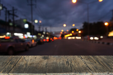 Empty dark wooden table in front of abstract blurred bokeh background of restaurant . can be used for display or montage your products.Mock up for space.