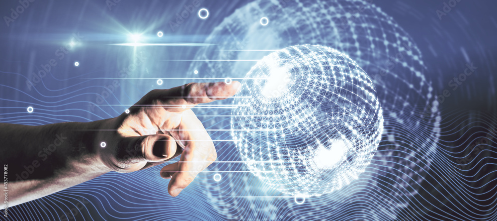 Poster Hand pointing at creative glowing polygonal globe interface on blue background. Network and digital communication concept.