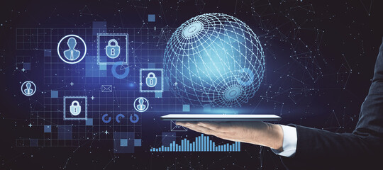 Businessman hand holding tablet with creative glowing business interface with globe and communication icons. Network, digital transformation, finance and ai concept.