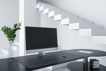 Close up of creative designer desktop with empty computer screen, decorative items and modern interior in the background. Mock up, 3D Rendering.