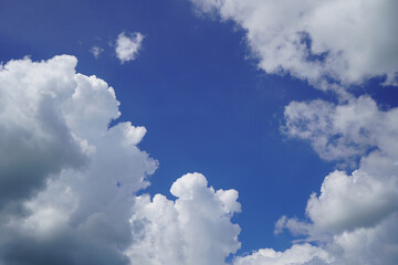 Sky background with the fluffy white clouds