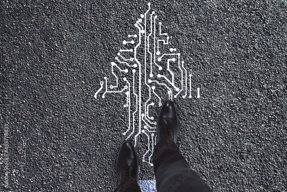 Poster Top view of man feet standing on abstract circuit arrow sketch on concrete ground background with mock up place. Success and digital transformation concept.