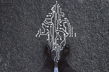 Top view of businessman feet standing on abstract circuit arrow sketch on concrete ground...