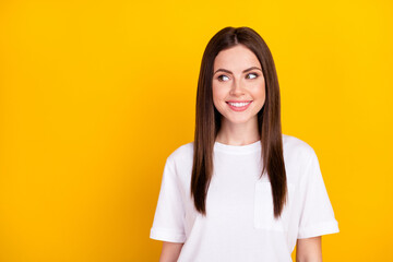 Photo of happy smiling positive good mood girl look copyspace dreaming thinking isolated on yellow...