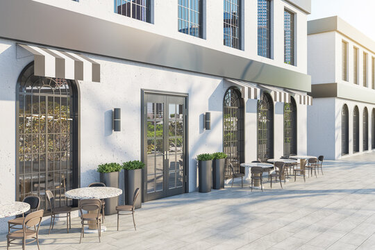 Contemporary concrete cafe exterior with terrace furniture in daylight. 3D Rendering.