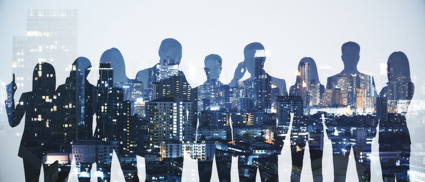 Wide image of business people silhouettes standing on abstract night city background. Teamwork and communication concept. Double exposure.