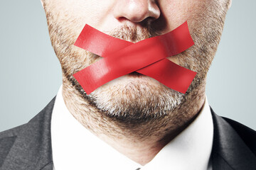 Close up of taped european businessman mouth. Silence and speech censorship concept. - obrazy, fototapety, plakaty