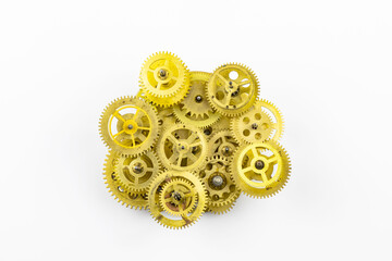 The old mechanism of bronze gears insulated on a white background.