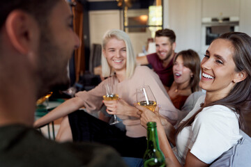 Friends chatting and drinking wine