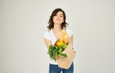 cheerful woman with a package of groceries healthy food supermarket shopping