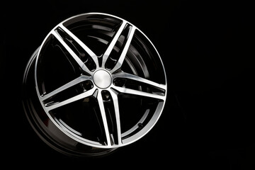 new black Alloy wheel sports car in the shape of a five-pointed star. copy space