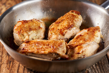 Seared chicken breasts in a pan