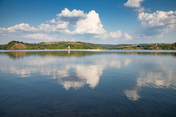 beautiful background of blue lake and sky reflection