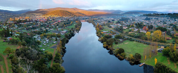 Panoramic shot of New Norfolk town in Tasmania, Australia during sunrise - obrazy, fototapety, plakaty