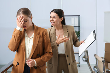 Boss screaming at employee in office. Toxic work environment